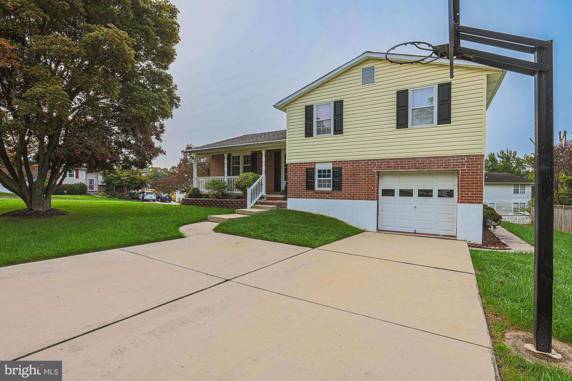 3923 Millner Road Baltimore, MD 21236 - Photo 3 of 38 a front view of a house with a yard