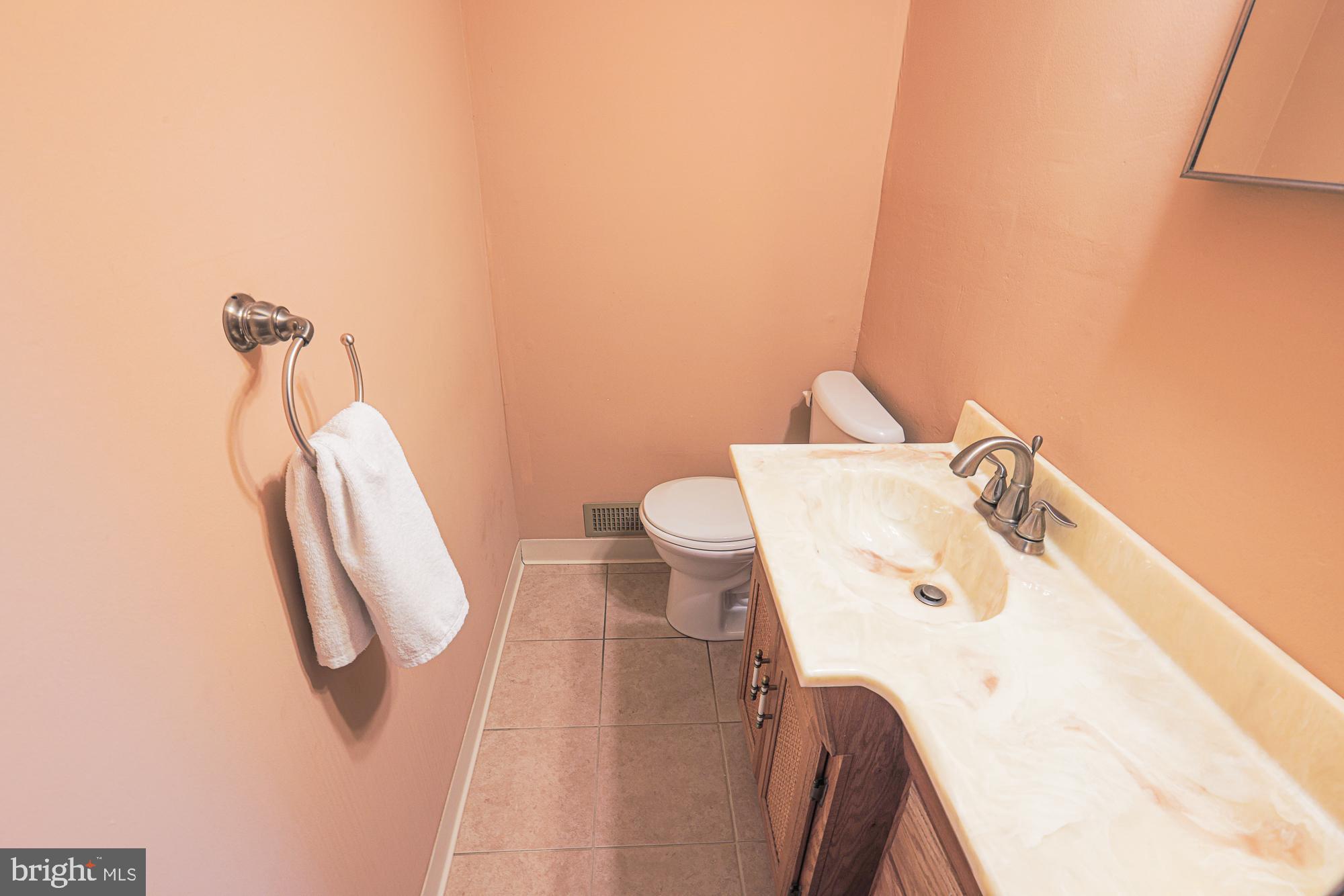 3923 Millner Road Baltimore, MD 21236 - Photo 32 of 38 a bathroom with a sink and toilet