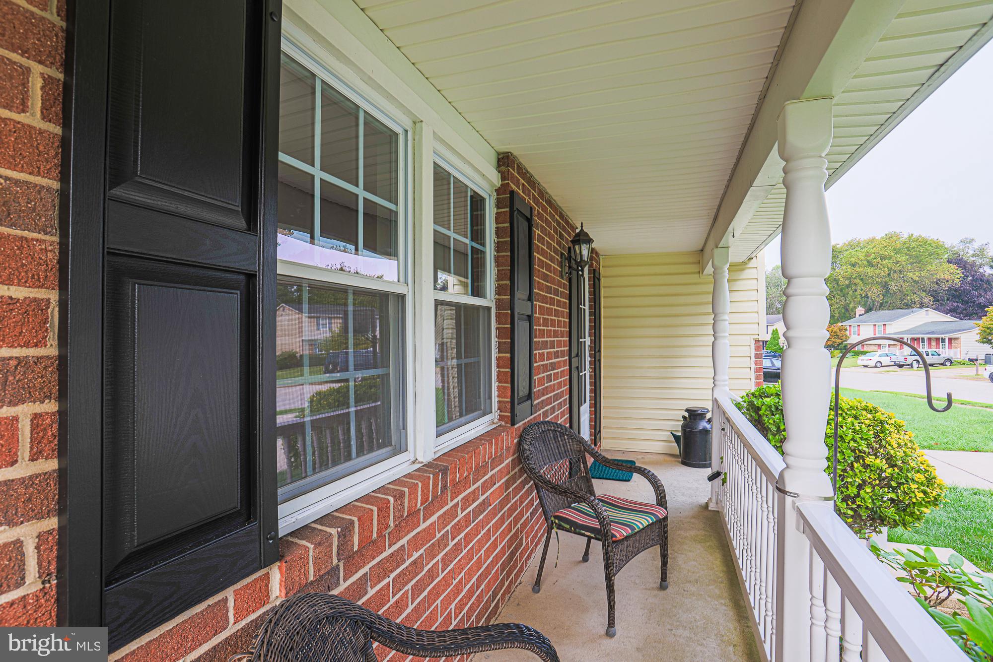 3923 Millner Road Baltimore, MD 21236 - Photo 4 of 38 a balcony view with a couch and wooden floor