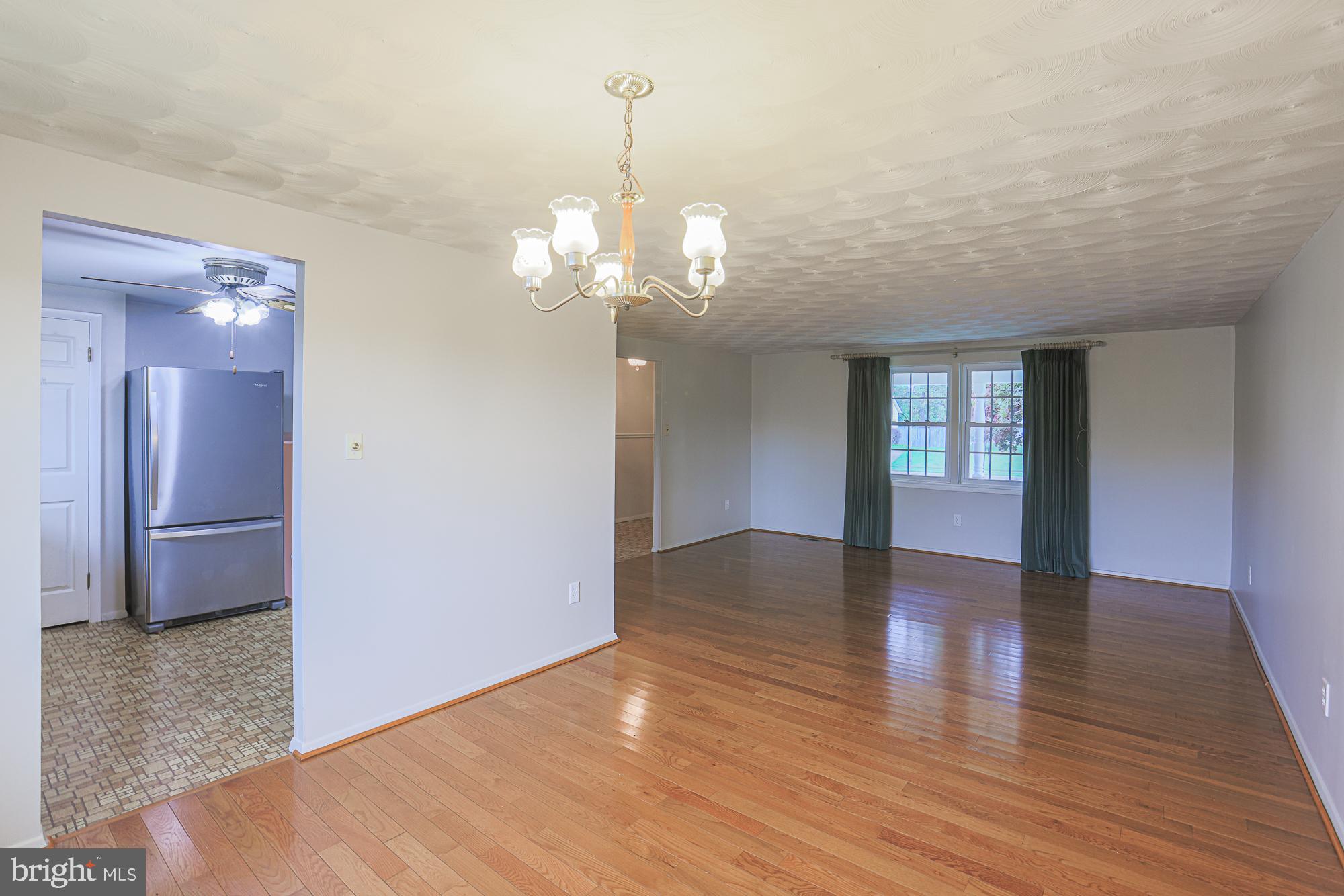 3923 Millner Road Baltimore, MD 21236 - Photo 10 of 38 a view of livingroom with hardwood floor and kitchen