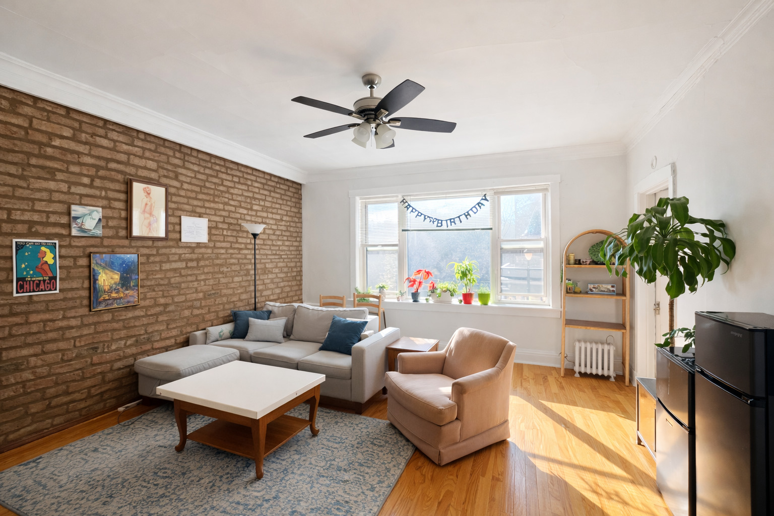 2461 North Clark Street, Unit 3 Chicago, IL 60614 - Photo 2 of 10 a living room with furniture a potted plant and a table