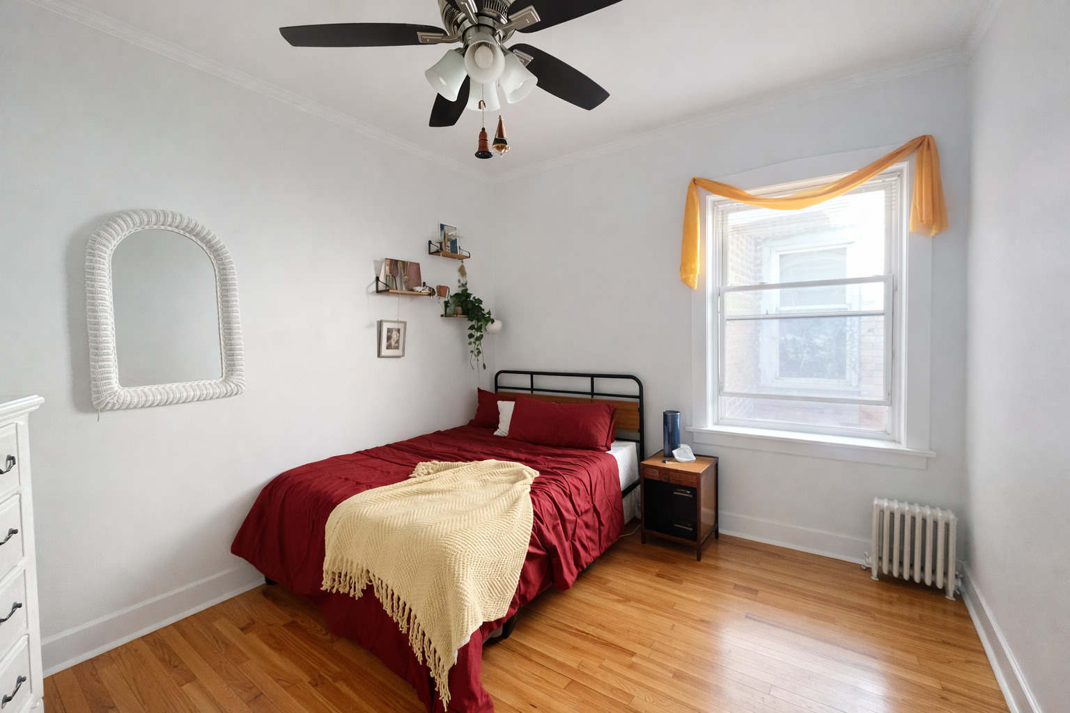 2461 North Clark Street, Unit 3 Chicago, IL 60614 - Photo 8 of 10 a bedroom with a bed and wooden floor