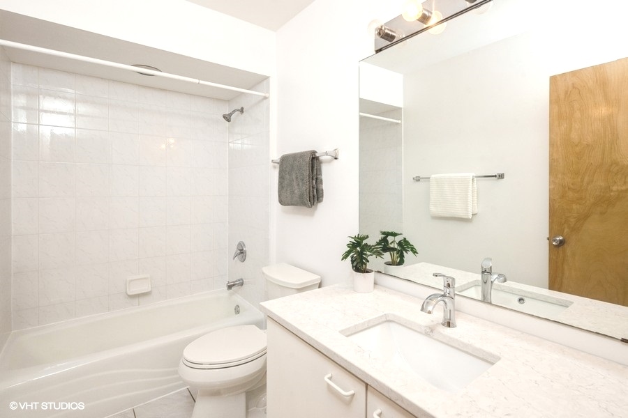 2002 West Potomac Avenue Chicago, IL 60622 - Photo 13 of 17 a bathroom with a sink toilet and shower