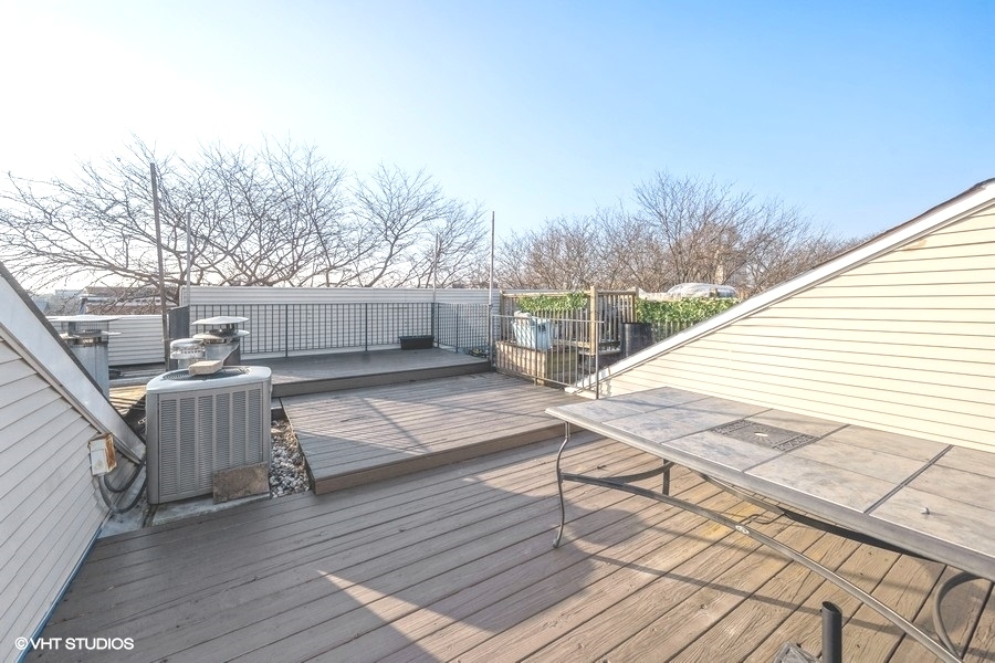 2002 West Potomac Avenue Chicago, IL 60622 - Photo 15 of 17 a balcony with wooden floor