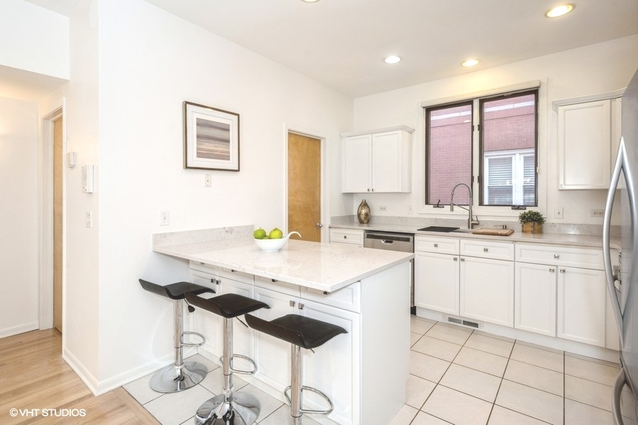 2002 West Potomac Avenue Chicago, IL 60622 - Photo 7 of 17 a kitchen with appliances cabinets and furniture