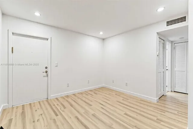 wooden floor in a hall with an entryway