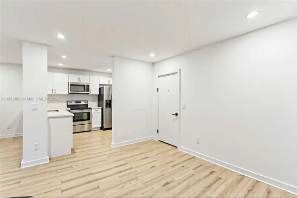 a view of kitchen with wooden floor