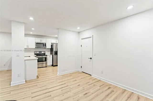a view of kitchen with wooden floor