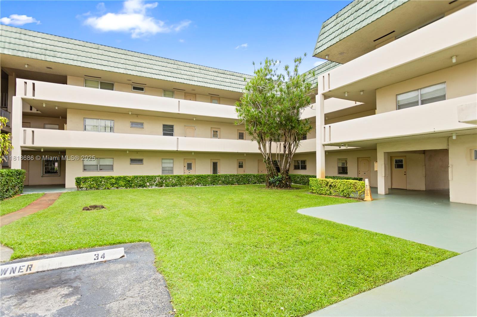 5790 Stirling Road, Unit 212 Hollywood, FL 33021 - Photo 3 of 22 a front view of a house with a yard table and chairs