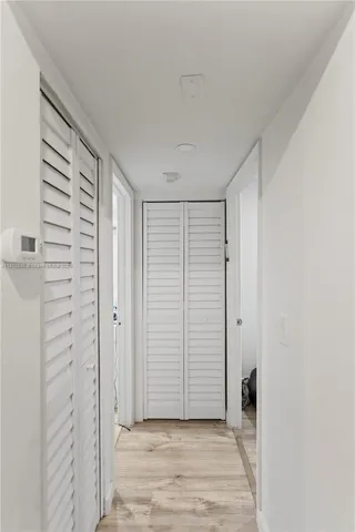 an empty room with wooden door
