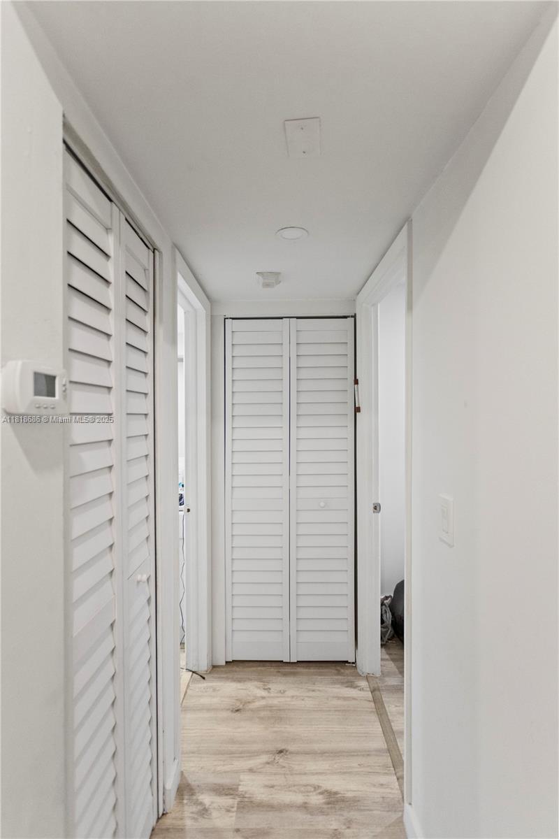 5790 Stirling Road, Unit 212 Hollywood, FL 33021 - Photo 7 of 22 an empty room with wooden door