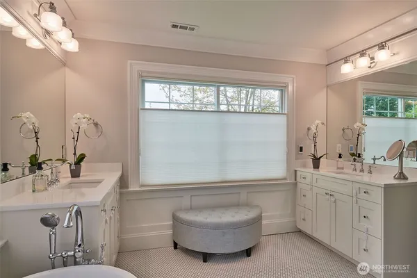 a bathroom with a sink a toilet and mirror