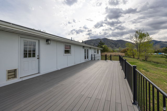 4155 Johnson Road Nibley, UT 84321 - Photo 46 of 71 Deck featuring a yard and a mountain view