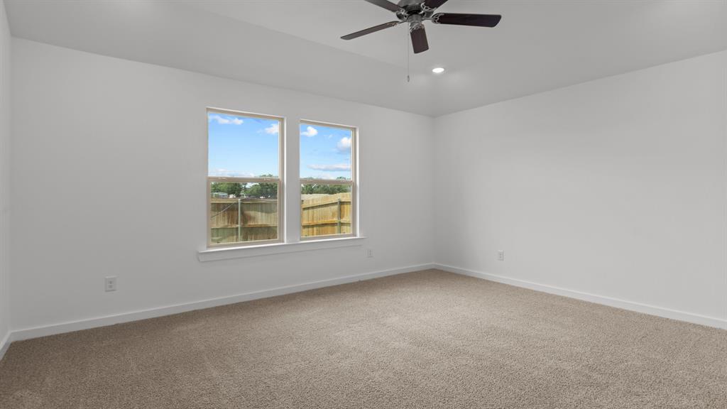 3408 Rendezvous Way Sherman, TX 75090 - Photo 16 of 21 Unfurnished room with carpet floors, recessed lighting, and a ceiling fan