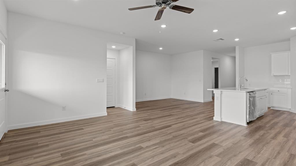 3408 Rendezvous Way Sherman, TX 75090 - Photo 4 of 21 Unfurnished living room featuring recessed lighting, light wood finished floors, and ceiling fan