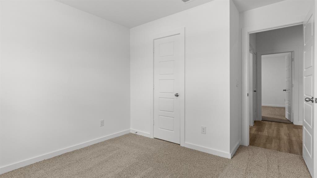 3408 Rendezvous Way Sherman, TX 75090 - Photo 10 of 21 Unfurnished bedroom featuring carpet and a closet