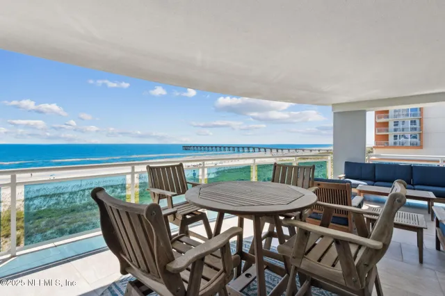 a spacious bathroom with a granite countertop sink a mirror and a bathtub