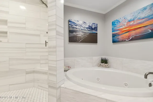 a front view of a building with a garden and plants