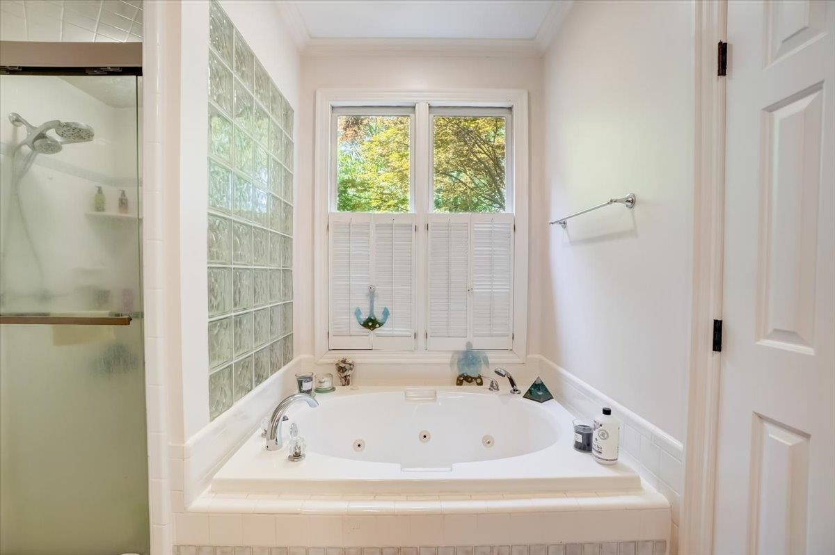 1446 Frazier Road Spring Hope, NC 27882 - Photo 13 of 28 a white bath tub sitting next to a shower