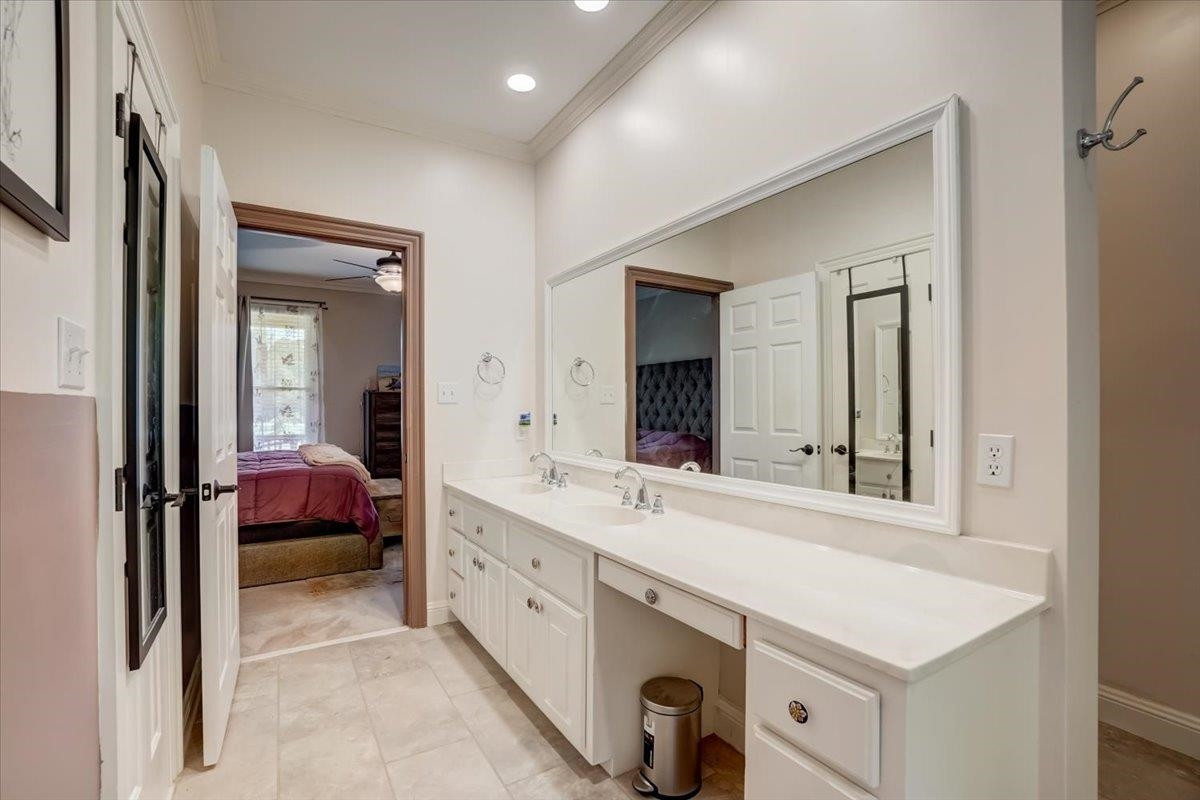 1446 Frazier Road Spring Hope, NC 27882 - Photo 14 of 28 a bathroom with a sink and a mirror