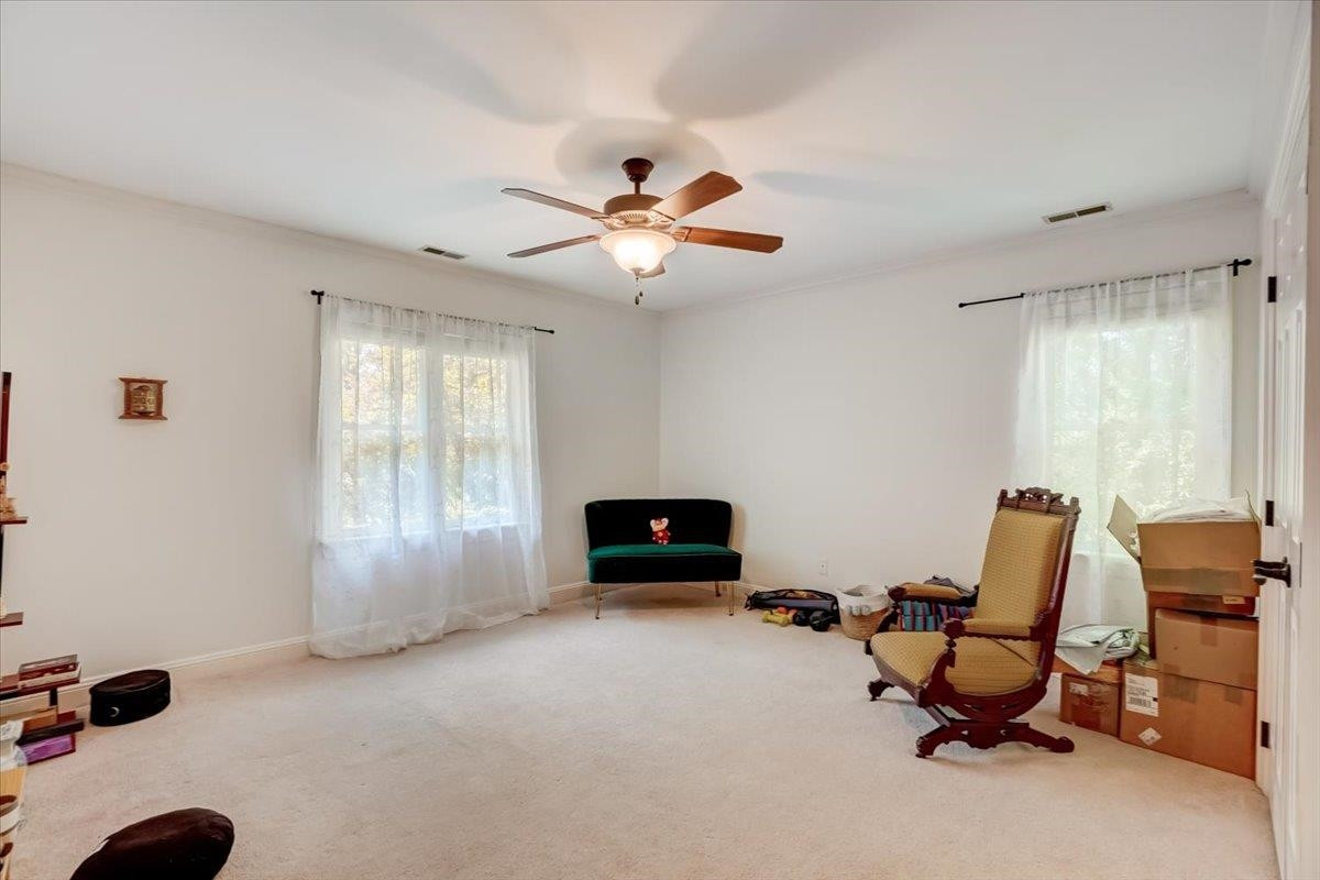 1446 Frazier Road Spring Hope, NC 27882 - Photo 15 of 28 a living room with furniture and a chandelier