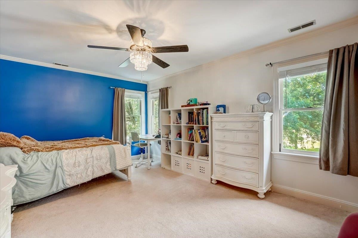 1446 Frazier Road Spring Hope, NC 27882 - Photo 18 of 28 a bed room with a bed and a window