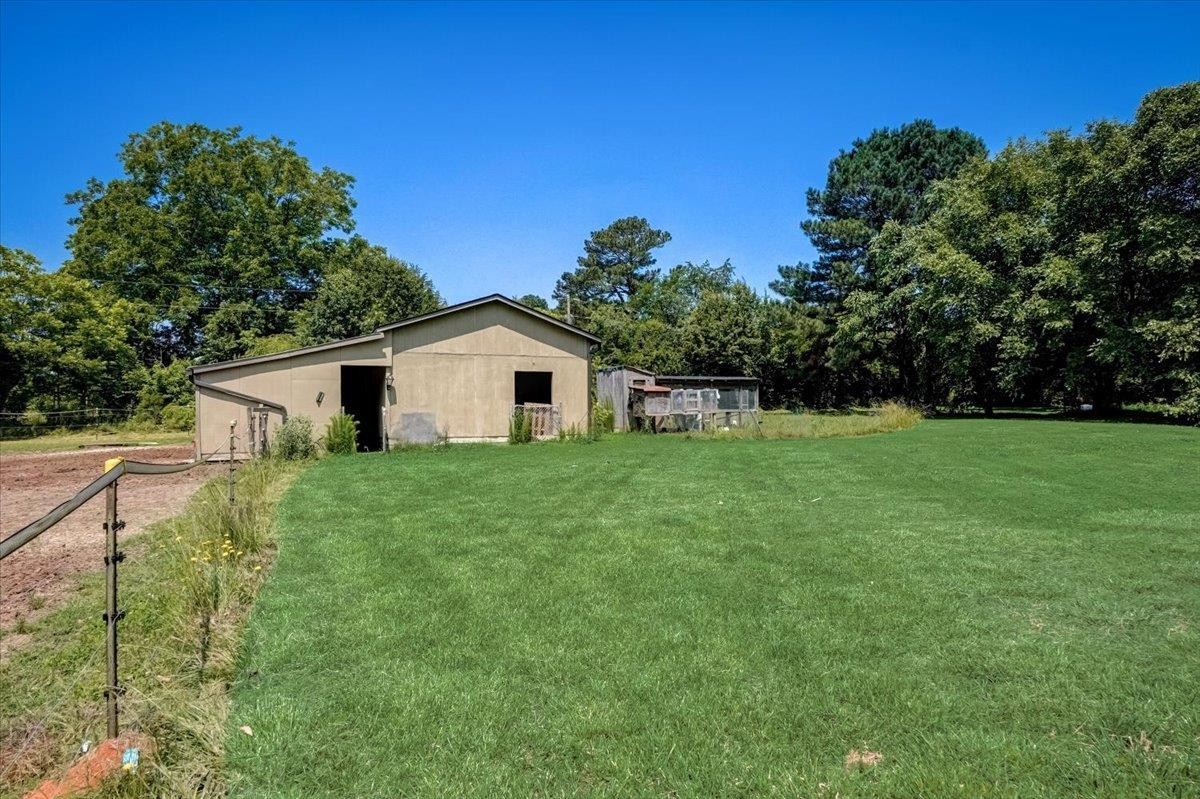 1446 Frazier Road Spring Hope, NC 27882 - Photo 24 of 28 a view of a house with backyard and garden