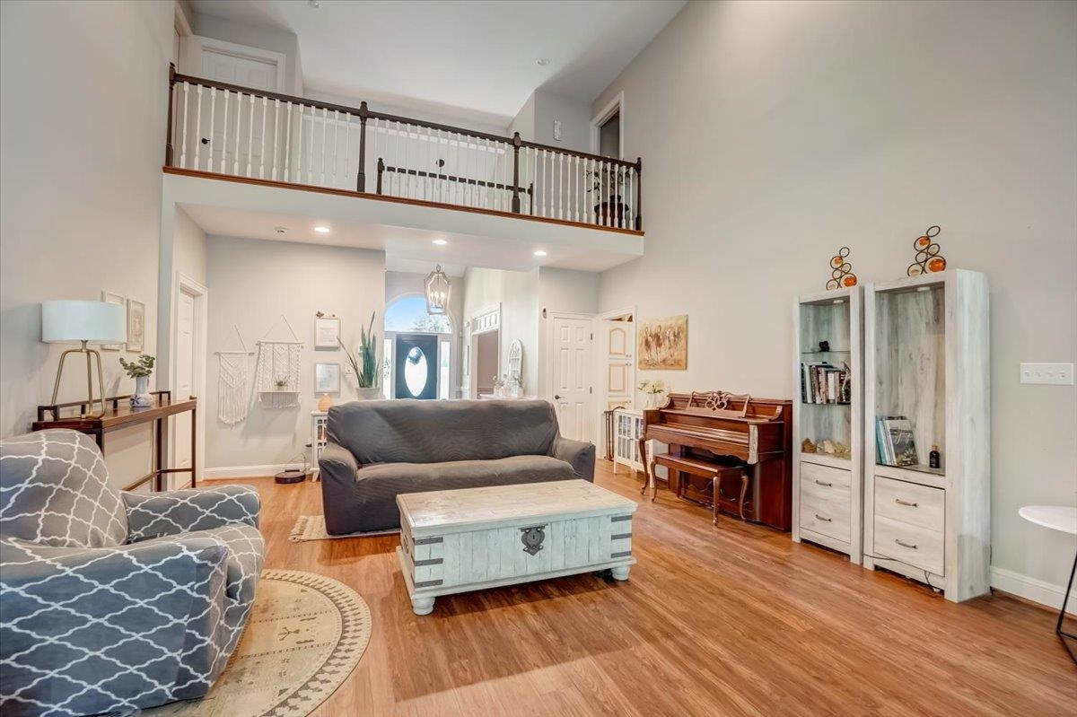 1446 Frazier Road Spring Hope, NC 27882 - Photo 7 of 28 a living room with furniture and a wooden floor