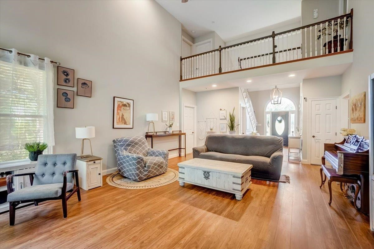 1446 Frazier Road Spring Hope, NC 27882 - Photo 8 of 28 a living room with furniture and a wooden floor