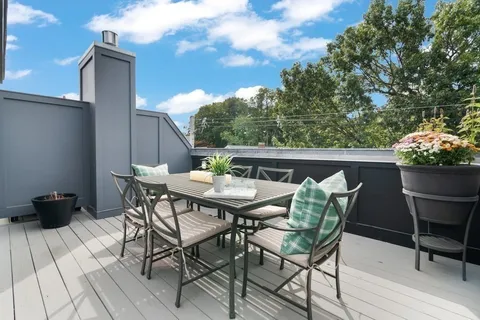 a view of an outdoor space with furniture