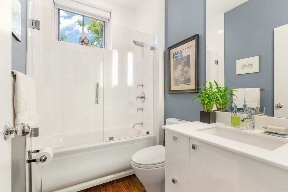 66 Seaverns Avenue, Unit 68B Boston, MA 02130 - Photo 12 of 30 a bathroom with a granite countertop sink a toilet and shower