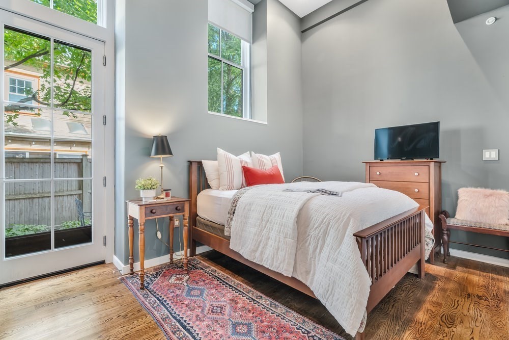 66 Seaverns Avenue, Unit 68B Boston, MA 02130 - Photo 23 of 30 a bedroom with a bed and window