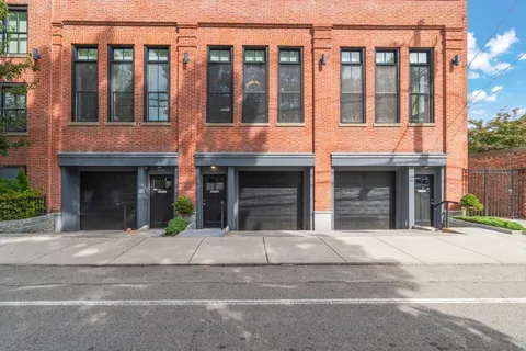a view of entrance gate of building and street