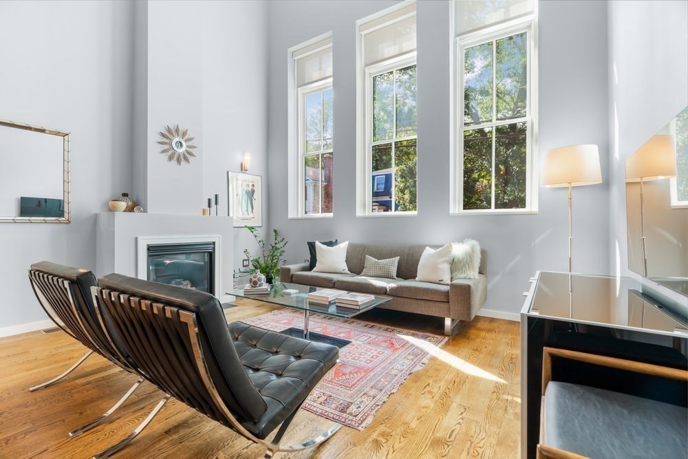 66 Seaverns Avenue, Unit 68B Boston, MA 02130 - Photo 5 of 30 a living room with furniture fireplace and a large window