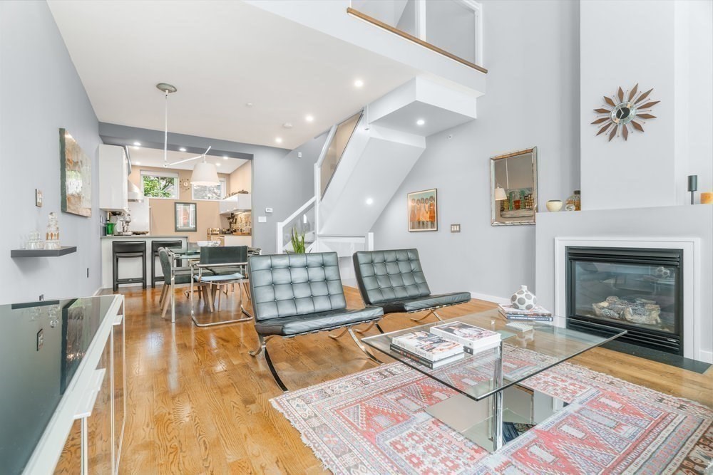 66 Seaverns Avenue, Unit 68B Boston, MA 02130 - Photo 7 of 30 a living room with furniture and a fireplace