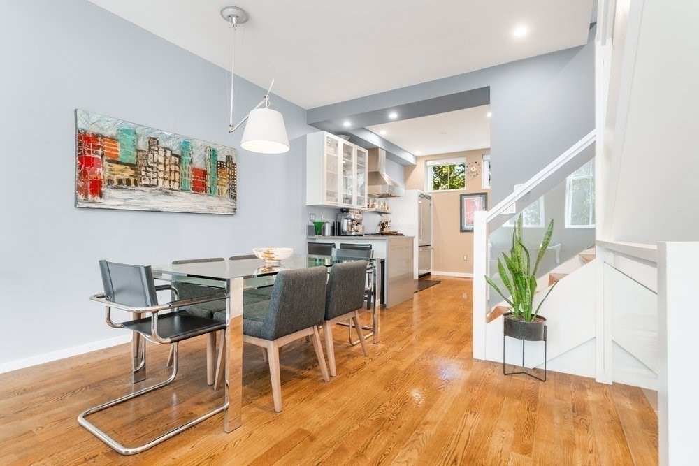 66 Seaverns Avenue, Unit 68B Boston, MA 02130 - Photo 8 of 30 a view of a dining room with furniture and wooden floor