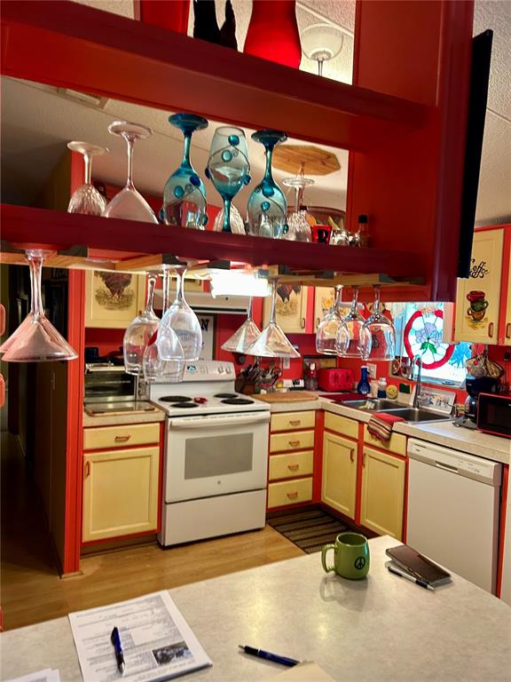 25646 Bass Road Astor, FL 32102 - Photo 25 of 48 a kitchen with stainless steel appliances granite countertop a sink stove and cabinets