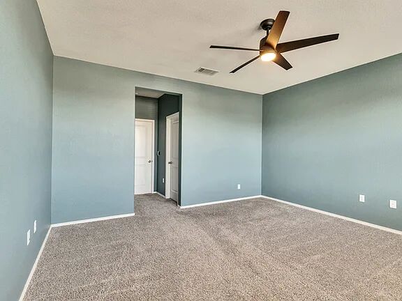 10403 Bramble Berry Drive Austin, TX 78748 - Photo 10 of 21 a view of a livingroom with a ceiling fan and wooden floor