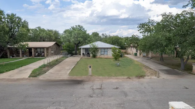 a view of house with outdoor space and swimming pool