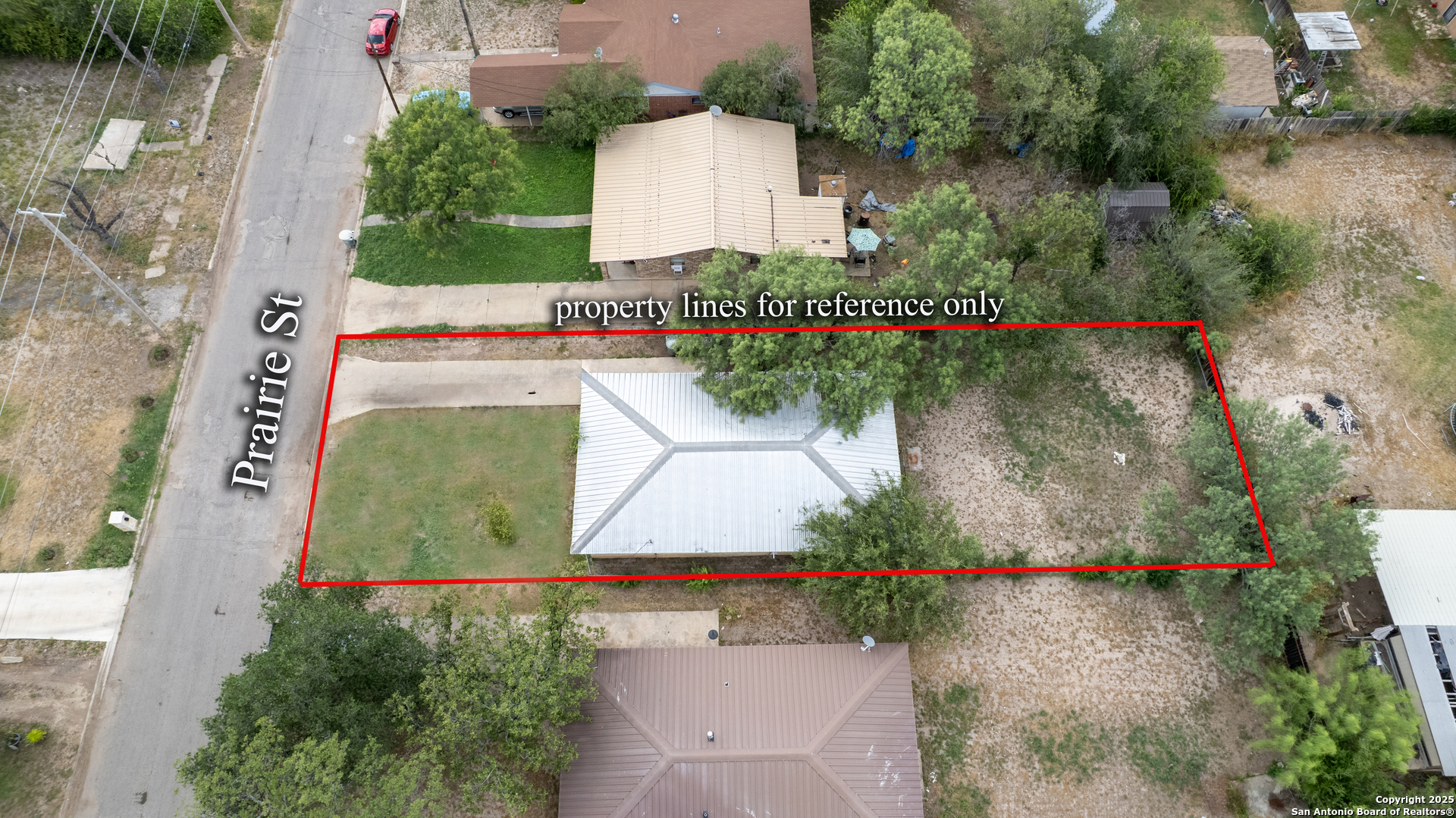 258 Prairie Street Uvalde, TX 78801 - Photo 17 of 19 an aerial view of a house with a yard and garden