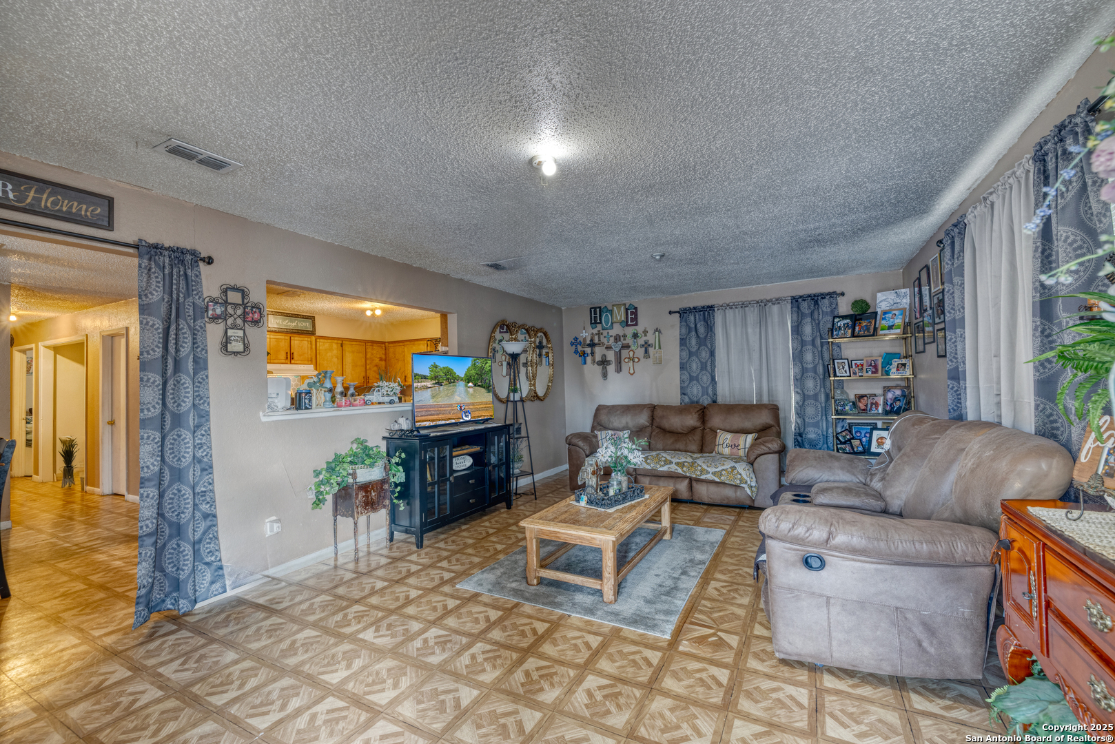 258 Prairie Street Uvalde, TX 78801 - Photo 2 of 19 a living room with furniture and a flat screen tv