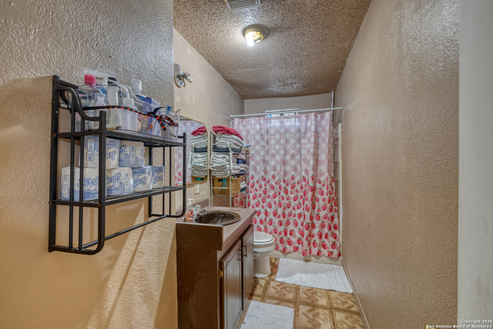 258 Prairie Street Uvalde, TX 78801 - Photo 7 of 19 a view of entryway with a stairs and a table