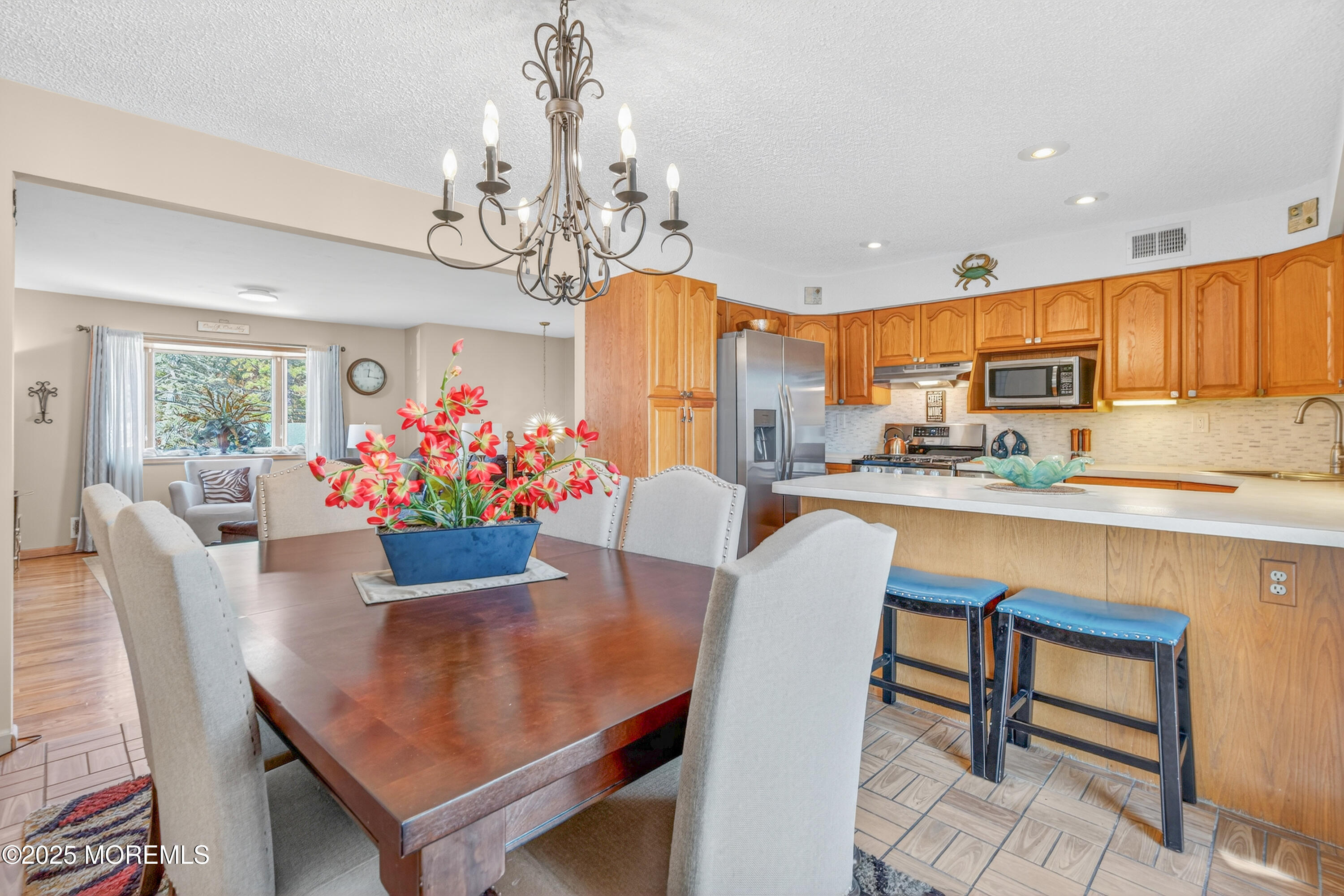 35 Heather Road Toms River, NJ 08753 - Photo 11 of 40 a dining room filled chandelier and kitchen view
