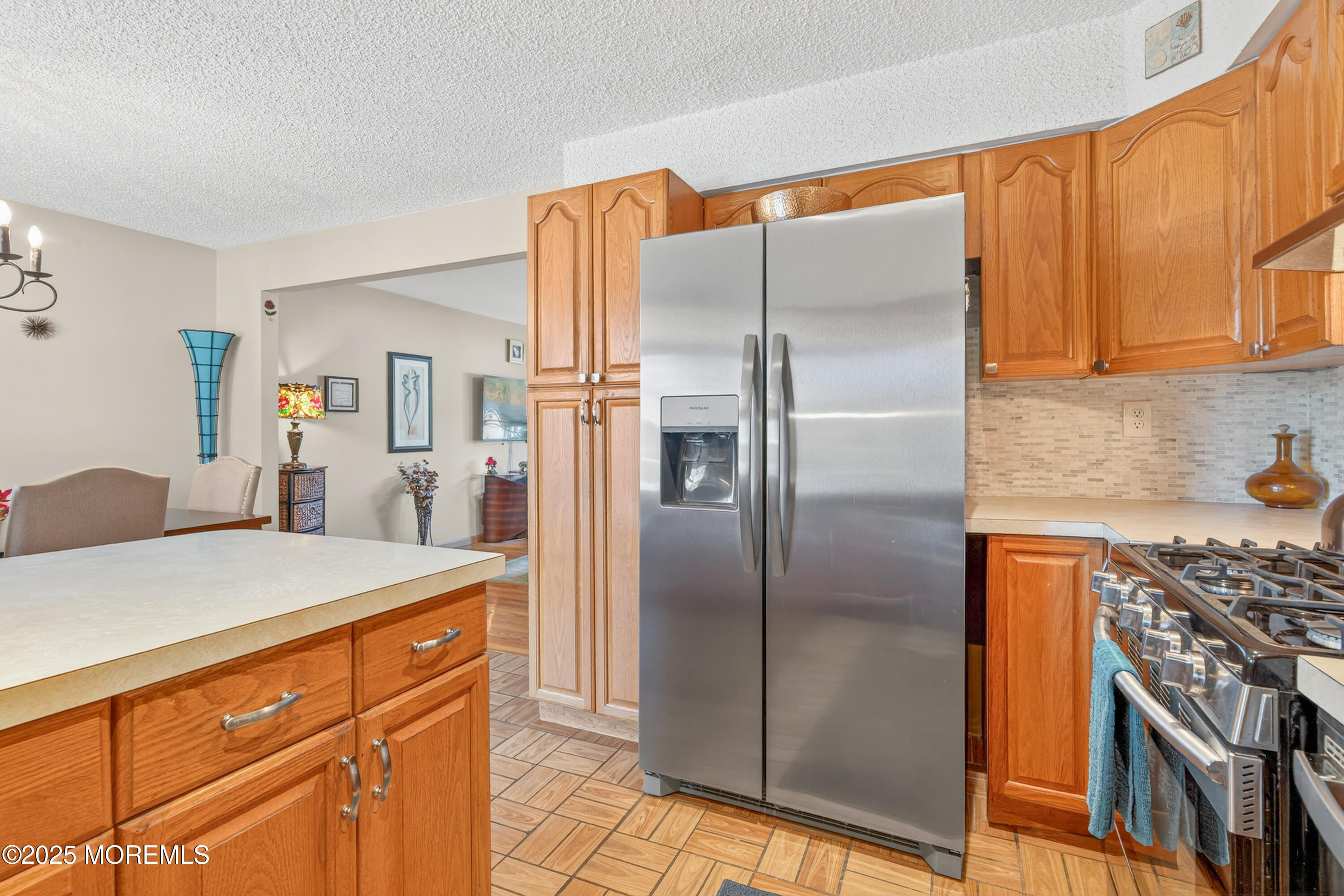 35 Heather Road Toms River, NJ 08753 - Photo 15 of 40 a kitchen with stainless steel appliances granite countertop a refrigerator a oven and white cabinets