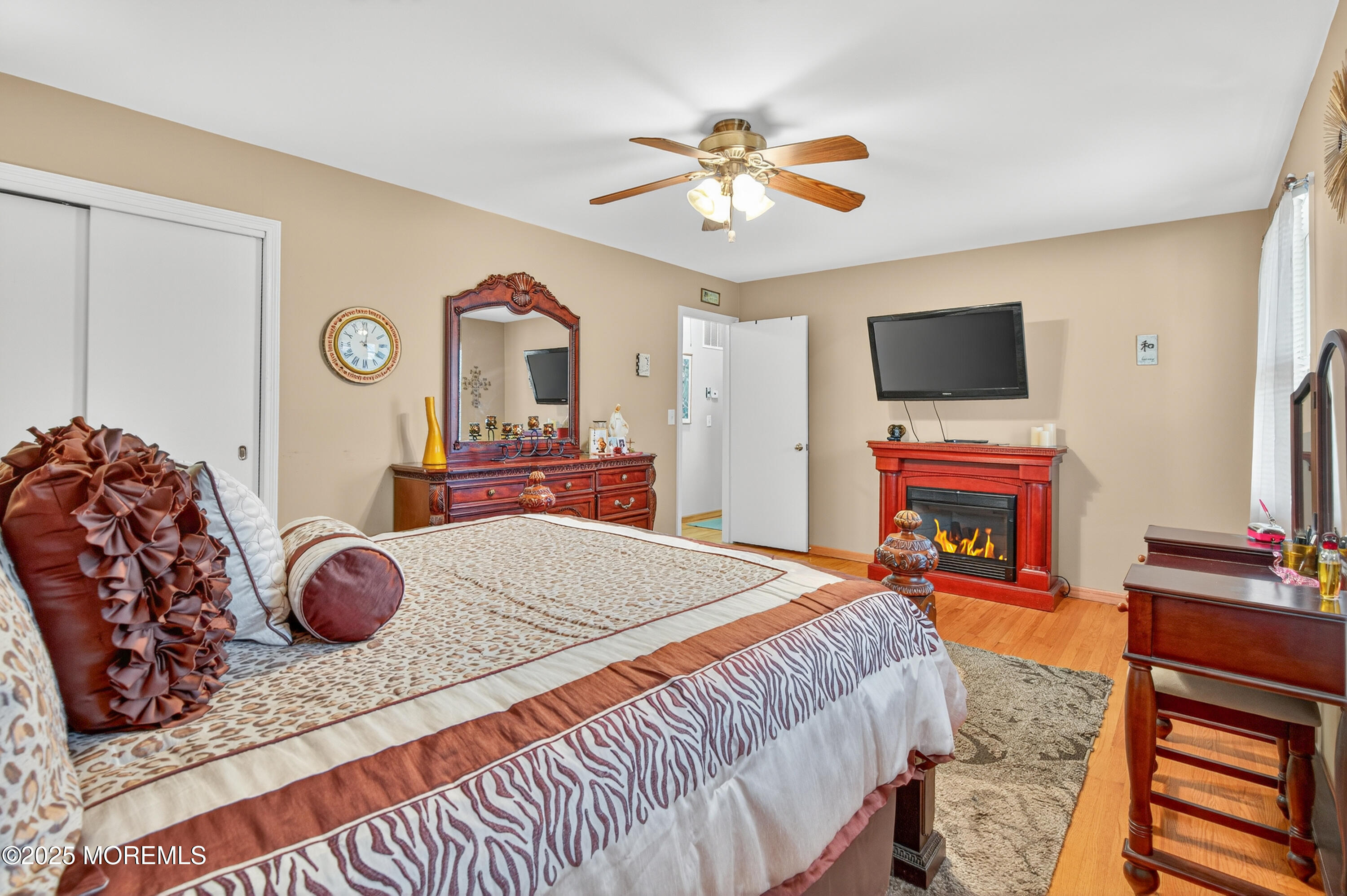 35 Heather Road Toms River, NJ 08753 - Photo 18 of 40 a bedroom with a bed and a flat screen tv