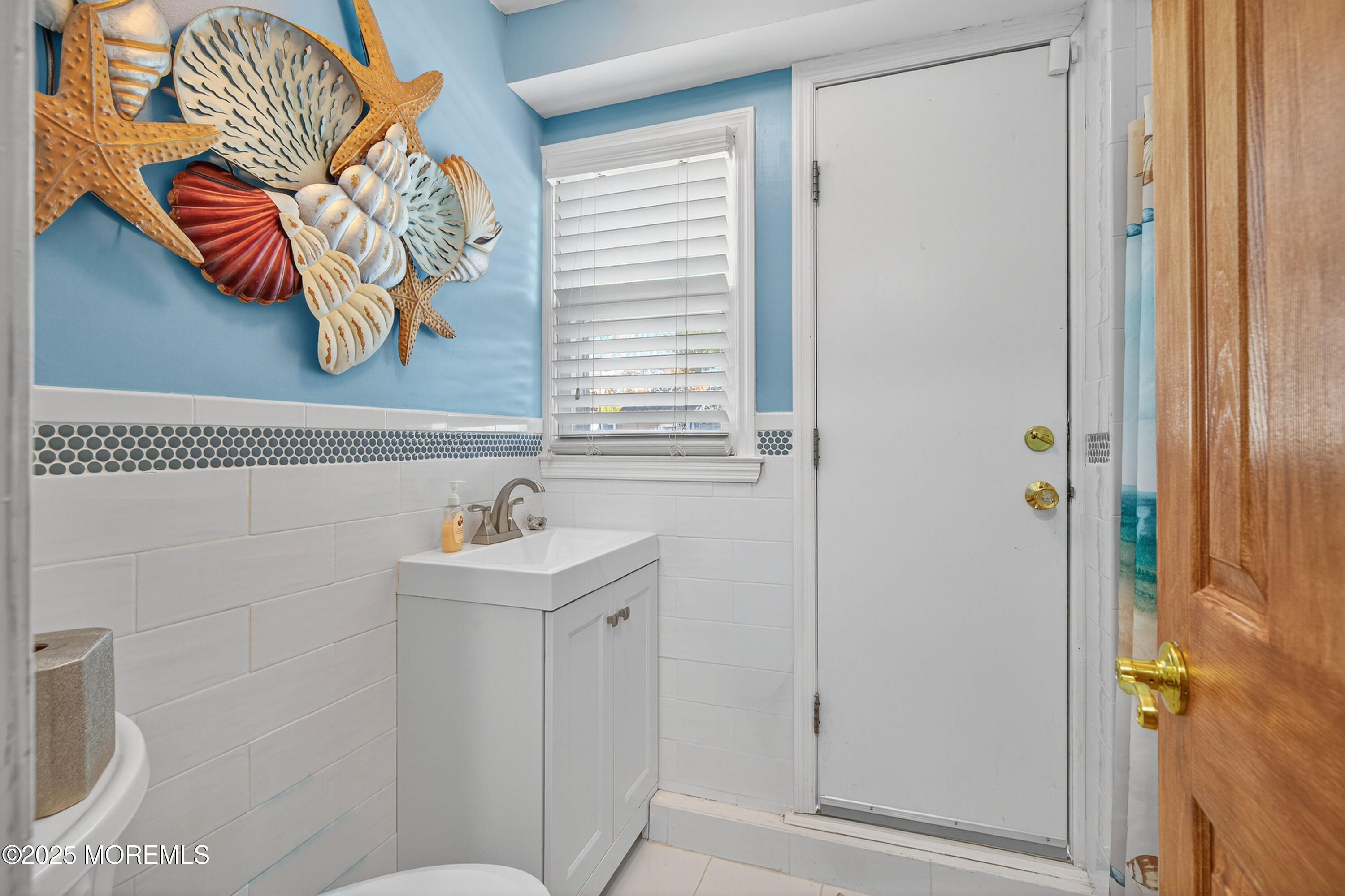 35 Heather Road Toms River, NJ 08753 - Photo 27 of 40 a bathroom with a sink and mirror with toilet