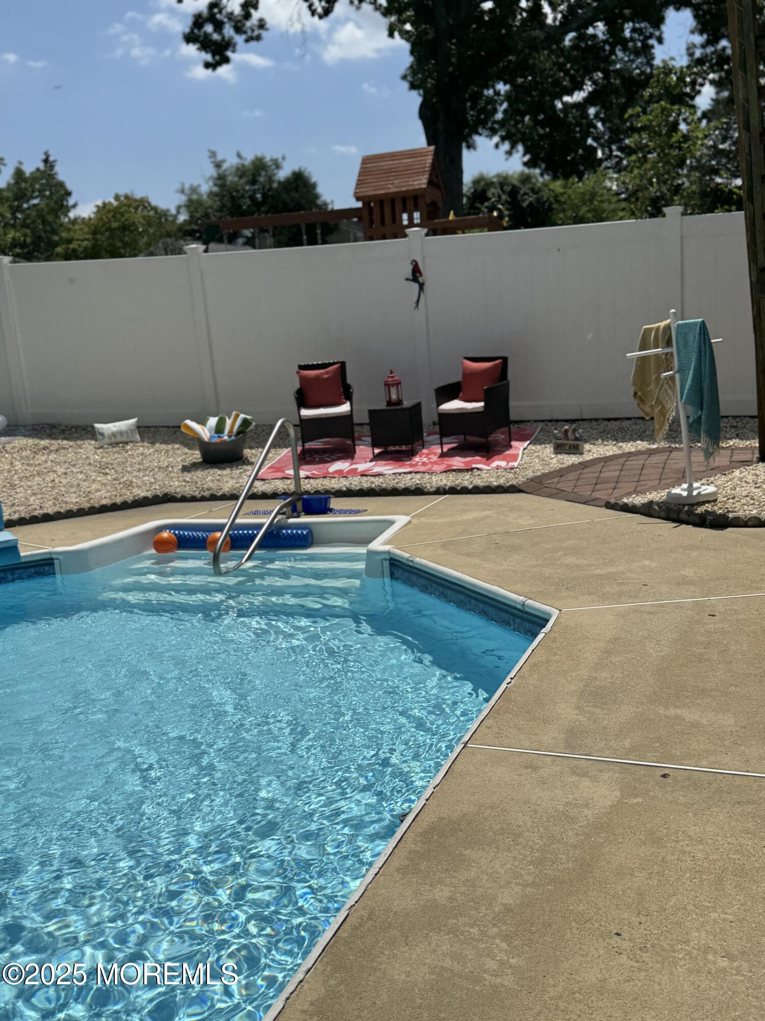 35 Heather Road Toms River, NJ 08753 - Photo 30 of 40 a backyard of a house with table and chairs