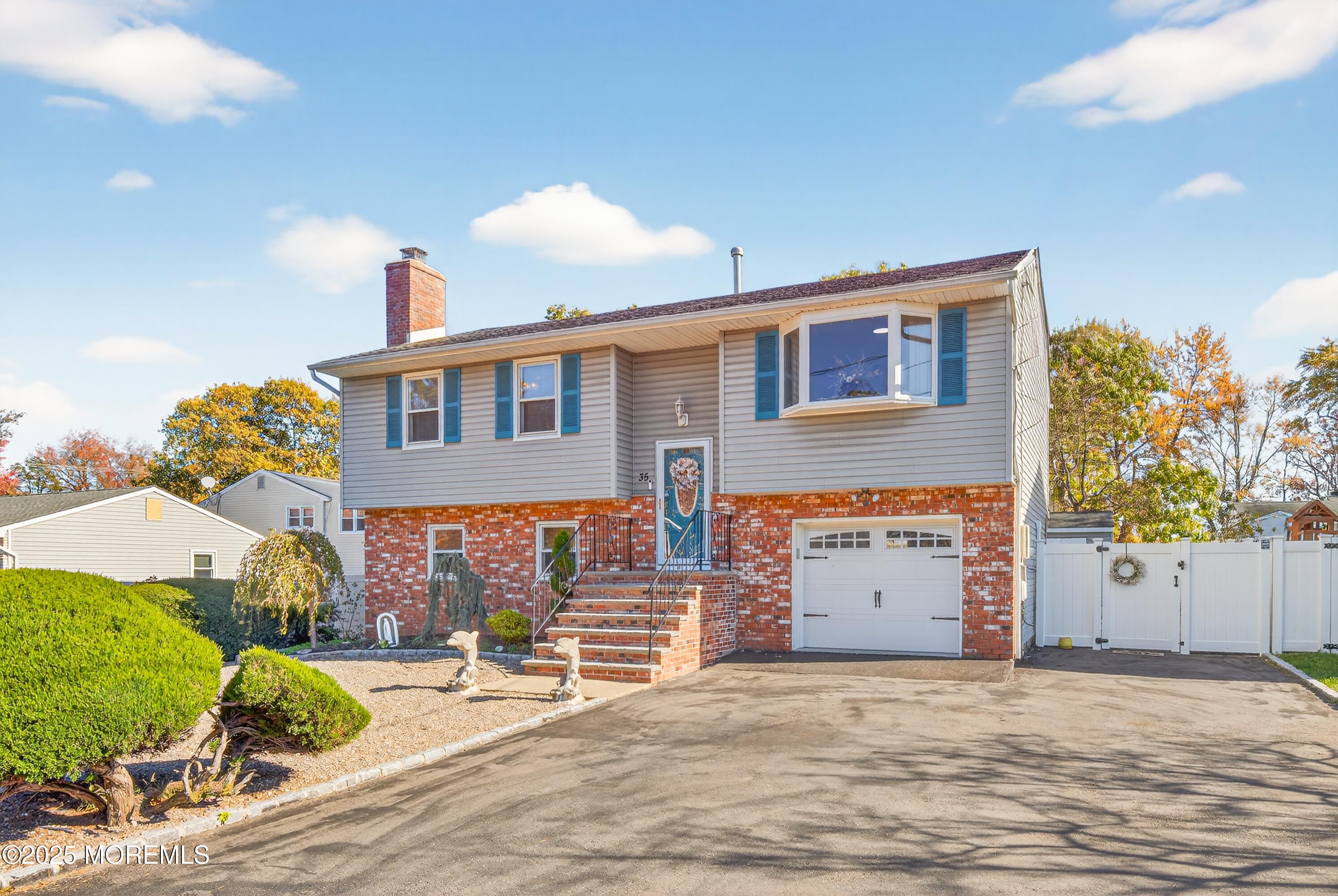 35 Heather Road Toms River, NJ 08753 - Photo 3 of 40 a front view of a house with a yard and garage