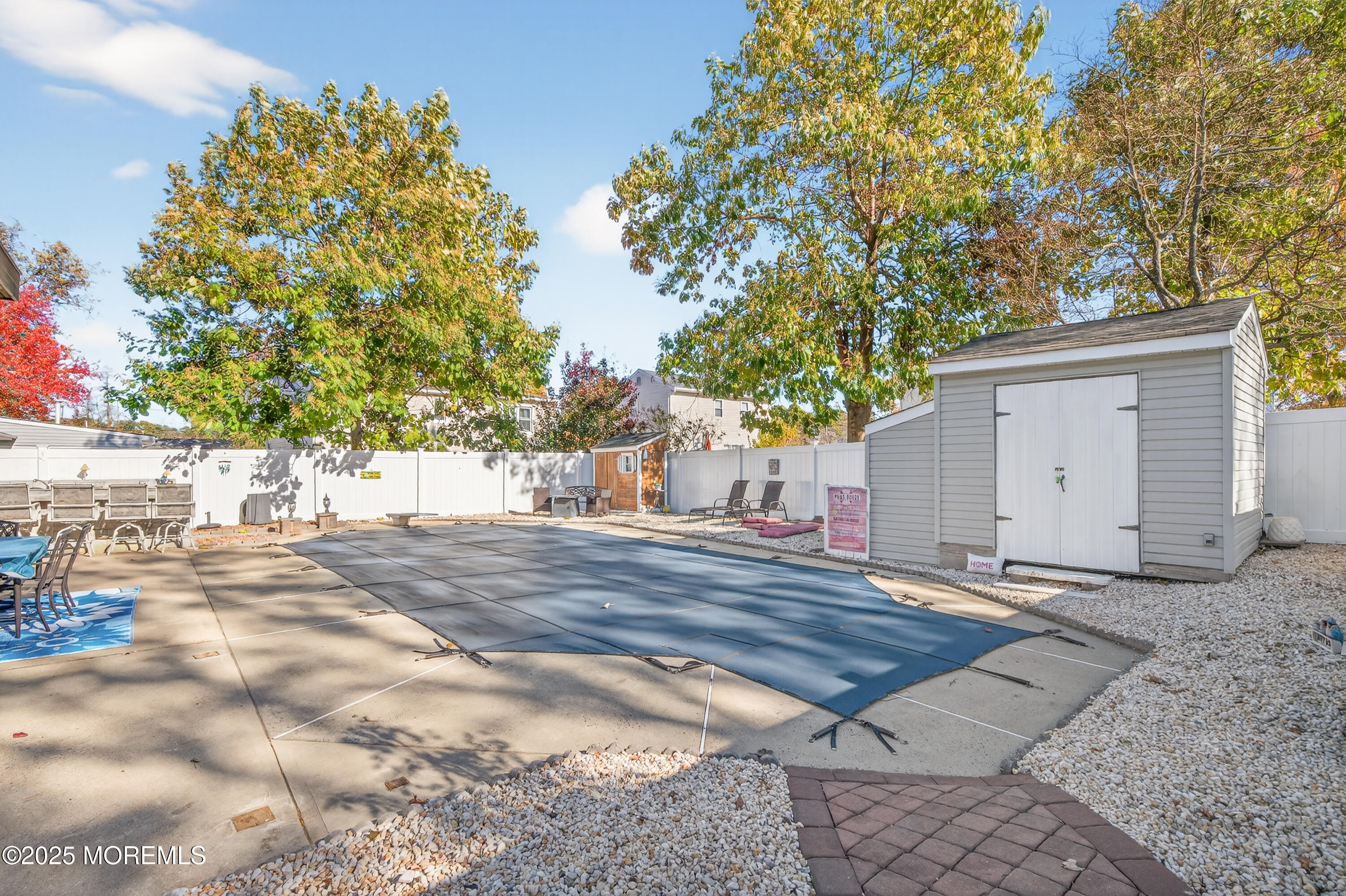 35 Heather Road Toms River, NJ 08753 - Photo 37 of 40 a view of a backyard with a tree