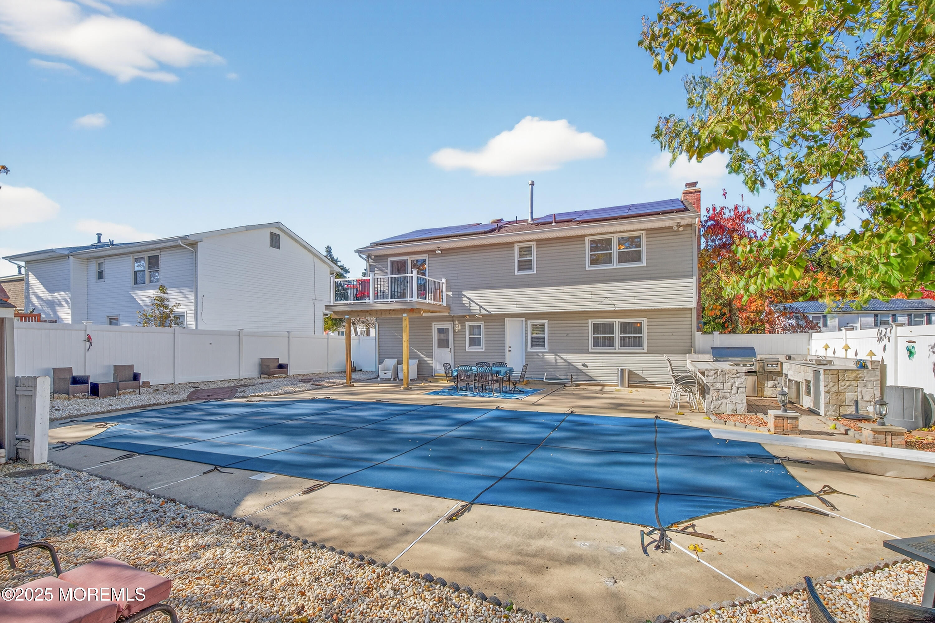 35 Heather Road Toms River, NJ 08753 - Photo 39 of 40 a living room with furniture and a chandelier